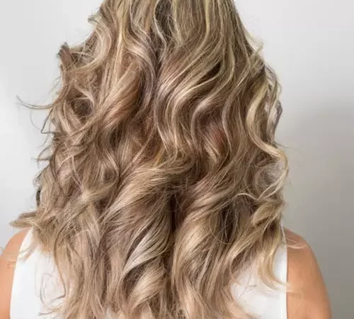 Flowy blonde curly hairstyle.jpg